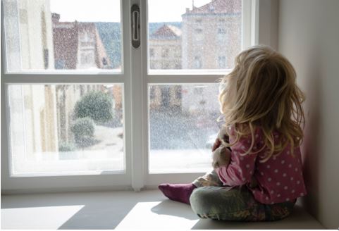 girl looking out window